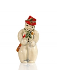 Shaped with a vintage chocolate mold for sweet, one-of-a-kind style, this charming Vaillancourt snowman figurine is hand painted in a dapper red hat and green scarf for extra-festive flair.