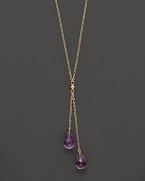 Twin amethyst briolettes sparkle from this 14K yellow gold lariat necklace.