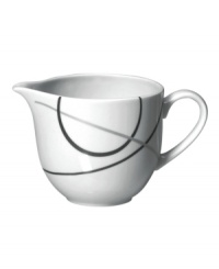 With a free-flowing circle design in shades of gray from Mikasa dinnerware, dishes like this bright white creamer add fun, contemporary appeal to any table. In ultra-durable porcelain.