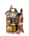 Home is where the heart is. This brilliantly crafted porcelain ornament from Department 56 displays Bob Cratchet's house as a special delivery is being made for the family on Christmas day. Intricately painted to mirror Dickens' beautiful settings in A Christmas Carol.