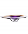 With the extraordinary beauty and grace of an orchid blossom, this Kosta Boda platter adds brilliant artistry to modern interiors. Luxurious art glass hand-crafted in a wide, fluid shape glistens with streaks of rich violet and warm amber.