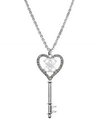 GUESS has the key to your heart with this pendant necklace. Crafted from silver-tone mixed metal with glistening glass crystal stones for a lustrous touch. Approximate length: 28 inches + 2-inch extender. Approximate drop: 3 inches.