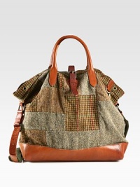 Evoking the aesthetic of vintage fishing bags, a timeless silhouette receives modern polish from a patchwork tweed construction with leather accents.Roller-buckle closureDouble top handlesAdjustable shoulder strapInterior zip pocketAntiqued brass grommet detailingReinforced leather bottomCotton twill liningTweed17W x 16H x 6DImported