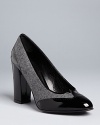 These Delman pumps are classic but trend-right, with fashionable menswear influences and polished almond toes.