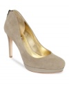 A golden-tipped zipper adds elegance to Joan & David's Wilma platform pumps.