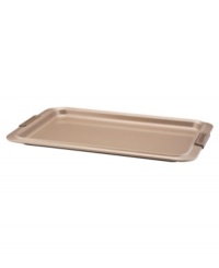 A cookie sheet that knows when to let go, this piece of bakeware is an essential for hassle-free cooking with a strong carbon steel core coated in a durable bronze nonstick finish that provides quick and effortless food release and fast cleaning. Designed with wide rimming along the edge, this cookie sheet is easy to maneuver and handle even with bulky oven mitts. Limited lifetime warranty.