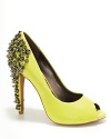 Sweet peeptoe in the front, punky spikes in the back. Coming or going, Sam Edelman's pumps make an impression.