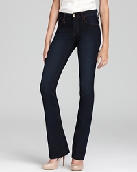 A flattering dark wash denim jean for a curvy, bootcut fit with a slim, slightly-flared leg.