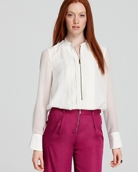 Menswear inspired, this sleek and chic tuxedo shirt features flat pleats and sheer sleeves to create a haute counterpoint with or without a blazer.