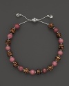 Bamboo and rhodonite beads make a vibrant pairing on this timeless Gucci bracelet.