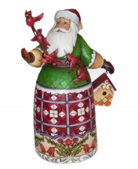 With a cardinal on his staff and carved in his skirt, this meticulously handcrafted Santa Claus collectible from Jim Shore extends Christmas spirit to all creatures, large and small.