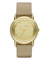 Metallic shimmer lights up this golden watch by Marc by Marc Jacobs. Metallic gold leather strap and round gold ion-plated stainless steel case. Gold tone mirrored dial features gold tone logo letters at markers and three hands. Quartz movement. Water resistant to 50 meters. Two-year limited warranty.