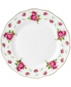 Revive a classic dinnerware pattern with the Vintage dinner plate. Lush pink blossoms plucked from the Old Country Roses collection flower on white bone china with a ruffled gold edge.