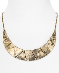 Styled to add tribal-inspired allure, this House of Harlow 1960 collar necklace features an engraved crescent, which gleams in 14-karat gold plate.