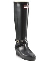 A new boot from Hunter! Tall wedge rain boots with criss-cross buckle straps at ankle.