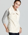 Plus faux fur lends ethereal spirit to a T Tahari vest for a sumptuous style statement.