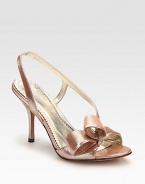 Pure primetime perfection, this shimmery metallic leather sandal has a secure slingback strap and elegant bow adornment. Self-covered heel, 4 (100mm)Metallic leather upperLeather lining and solePadded insoleImported