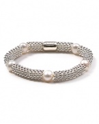 Make a bubbly statement with this sterling silver and pearl bracelet from Links of London. A cool option come party time, this bauble lends a shot of sparkle to your favorite cocktail mini.