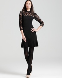 Sheer lace lends provocative edge to this DKNY dress, finished with a ruffled hemline for a darling yet dramatic look.