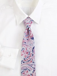 An artful paisley pattern distinguishes this fine Italian silk tie. About 3 wideSilkDry cleanMade in Italy