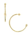 Do the delicate thing and swap your everyday studs for Melinda Maria's airy gold hoops. Hearts will melt.