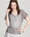 Boasting a sheer metallic sheen and a bold boxy cut, this Eileen Fisher top makes for a casual-glam statement.