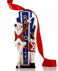 Kick off a spectacular Christmas season with the Radio City Rockette ornament. Posing in a sparkling red uniform with a matching toy soldier, this word-famous Christmas figure is an absolute show-stopper at all of your holiday gatherings.