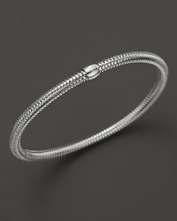 A modern mesh bangle in 18K white gold from Roberto Coin.