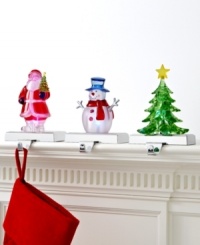 Merry and bright, these colorful figurines hold and light Christmas stockings with irresistible cheer. Featuring Santa, a snowman and tree perched on silvertone metal hooks.