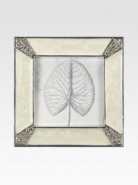 Masterful enameling has the look of lustrous mother-of-pearl in this elegant square frame with Swarovski crystals shimmering at each corner.Enamel and crystalWhite bronze finishHandmade, hand-enameled and hand-set2.75 square; holds a 2 square photoImported