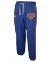 Show off your pride for the NY Knicks in these sweatpants by adidas.