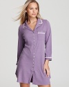 The comfort of his with the appeal of hers, this pocketed sleepshirt puts a twist on boyfriend style with floral applique detailing and soft colors.