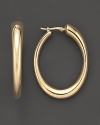 Oval hoops in matte 14K yellow gold.