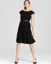 A swing skirt lends a ladylike look to this belted Anne Klein dress.