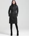 Stave off winter's chill in a decadent DKNY puffer coat, featuring contrast faux-leaher trim to keep things slim.