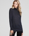 A fall wardrobe essential, our new Vince turtleneck, salutes the new season with bold horizontal stripes.