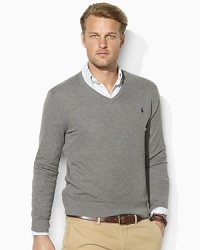 A refined V-neck sweater is knit from sumptuously soft cashmere and cotton yarns for a handsome, preppy look.