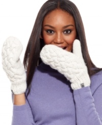 Keep hands completely cozy with these fleece-lined mittens from The North Face. Dressed in classic cable knit, they're at once classic and contemporary.