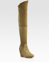 Thigh-high suede wedge design with an exposed back zipper and contoured shaft. Stacked wedge, 4 (100mm)Covered platform, ½(15mm)Compares to a 3½ heel (90mm)Shaft, 24Leg circumference, 15Suede upperBack zipperShearling liningRubber solePadded insoleMade in Italy