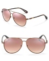 Classic aviator sunglasses with gradient lenses, contrast arms and signature logo detail along temples.