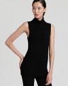 Made for layering, this Donna Karan New York sleeveless turtleneck hugs your figure and flaunts sheen at the trim for the most subtle touch of glamour.