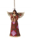 A distinct quilt pattern in red, plum and green make this praying angel ornament more striking than serene, and undeniably beautiful. With the unique folk-art style of Jim Shore.