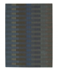 The Calvin Klein Loom Select Rug Collection offers a modern design approach to floor coverings with an emphasis on distinct colors and subtle textures. Woven in plush wool with refined accents of hand carving, these rugs provide a dense and luxurious texture, while a soft patina imbues each carpet with distinct depth and design distinction. This rug features a linear block pattern in muted blues and grays, adding modern versatility for your home.