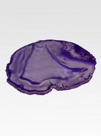 Made from semi-precious agate forged inside ancient volcanic tunnels, this hand-polished platter is ideal for displaying hors d'oeuvres or artisanal cheeses. Each piece is individually and naturally patterned; no two platters are exactly alike.9 diam.AgateRubber feetClean as necessary with a damp clothMade in USA of imported material