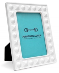 Jonathan Adler ensures modern spaces shape up nicely with this Charade picture frame, crafted of matte white porcelain studded with detail.