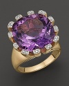 A spray of diamonds frames amethyst, set in 14K yellow gold.