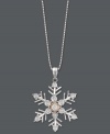 'Tis the season to let it snow! This unique snowflake-shaped pendant features a round-cut diamond accent at center. Crafted in sterling silver with 14k rose gold accents. Approximate length: 18 inches. Approximate drop: 1 inch x 3/4 inch.