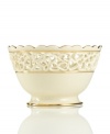 Distinguished by a scalloped edge, bands of gold and heart cutouts in creamy ivory porcelain, this lovely bowl combines traditional style and timeless grace.