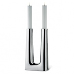 The candlestick was originally created in 1960 as an altar candle for use in a modern Scandinavian-style church.The 2007 version is in stainless steel and holds two tapered candles-the effect is striking. The structure of the candleholder is in many ways an iconic example of clean-lined Danish design of the post-World War II era.