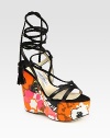 Vibrant, floral-print wedge with leather straps and braided suede laces that make their way up the ankle, concluding with tassels. Self-covered wedge, 5 (125mm)Covered platform, 2 (50mm)Compares to a 3 heel (75mm)Leather and suede upperLeather lining and solePadded insoleMade in ItalyOUR FIT MODEL RECOMMENDS ordering true size. 